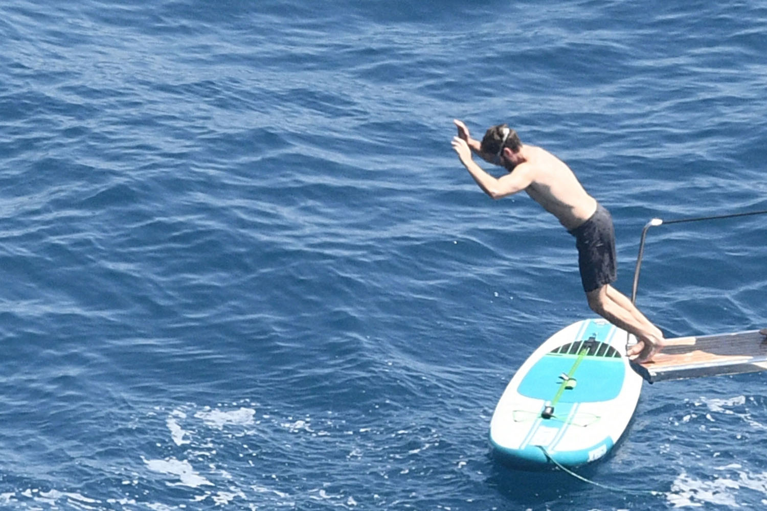 Andrew Garfield jumps off the boat