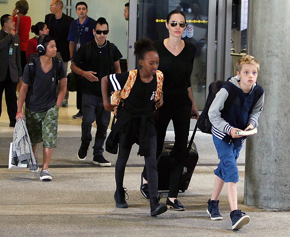 Angelina Jolie travels + 4