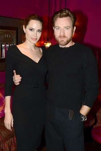 Angelina Jolie gives Ewan McGregor a leg up
