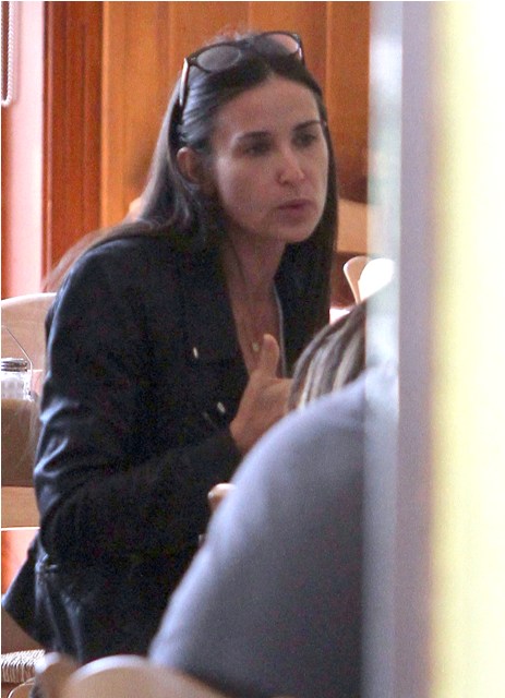 The real Demi covers up