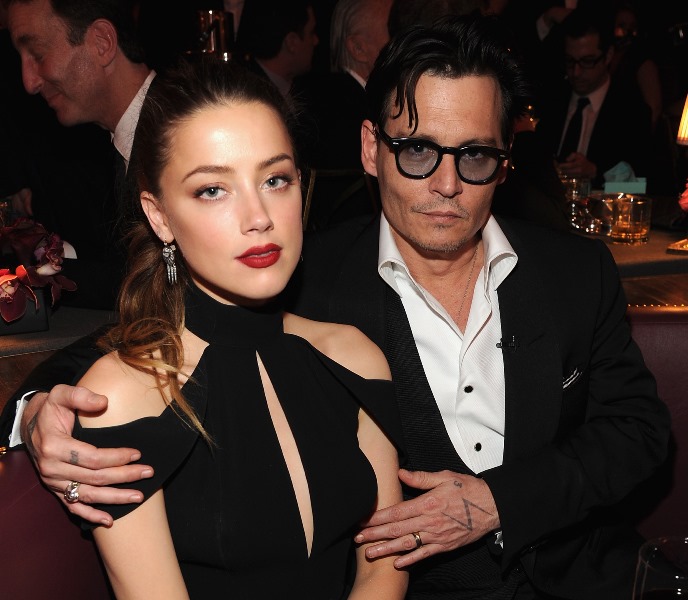 Johnny Depp holds his girlfriend