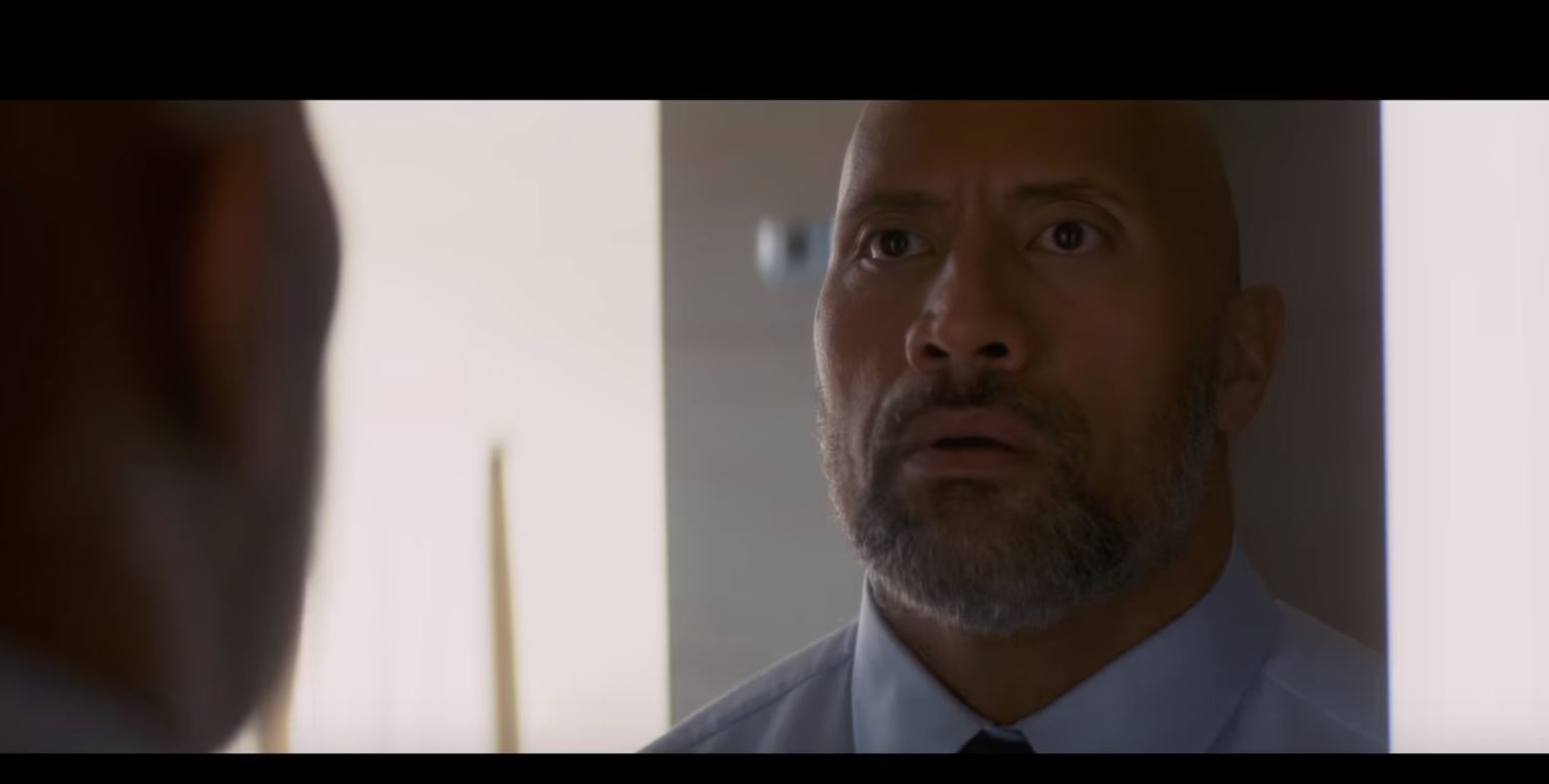 The Rock punches a building