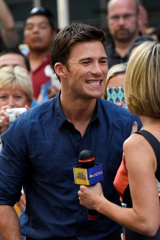 Scott Eastwood checks his teeth