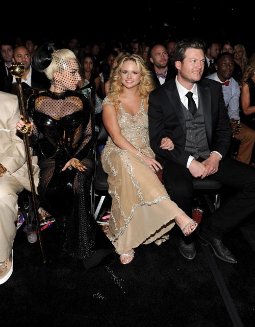 Lady Gaga sits