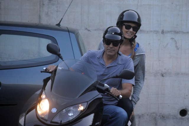 The back of Clooney’s bike is not empty