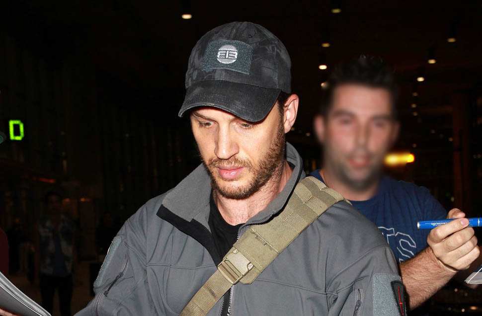 Tom Hardy just tends bar…and a puppy