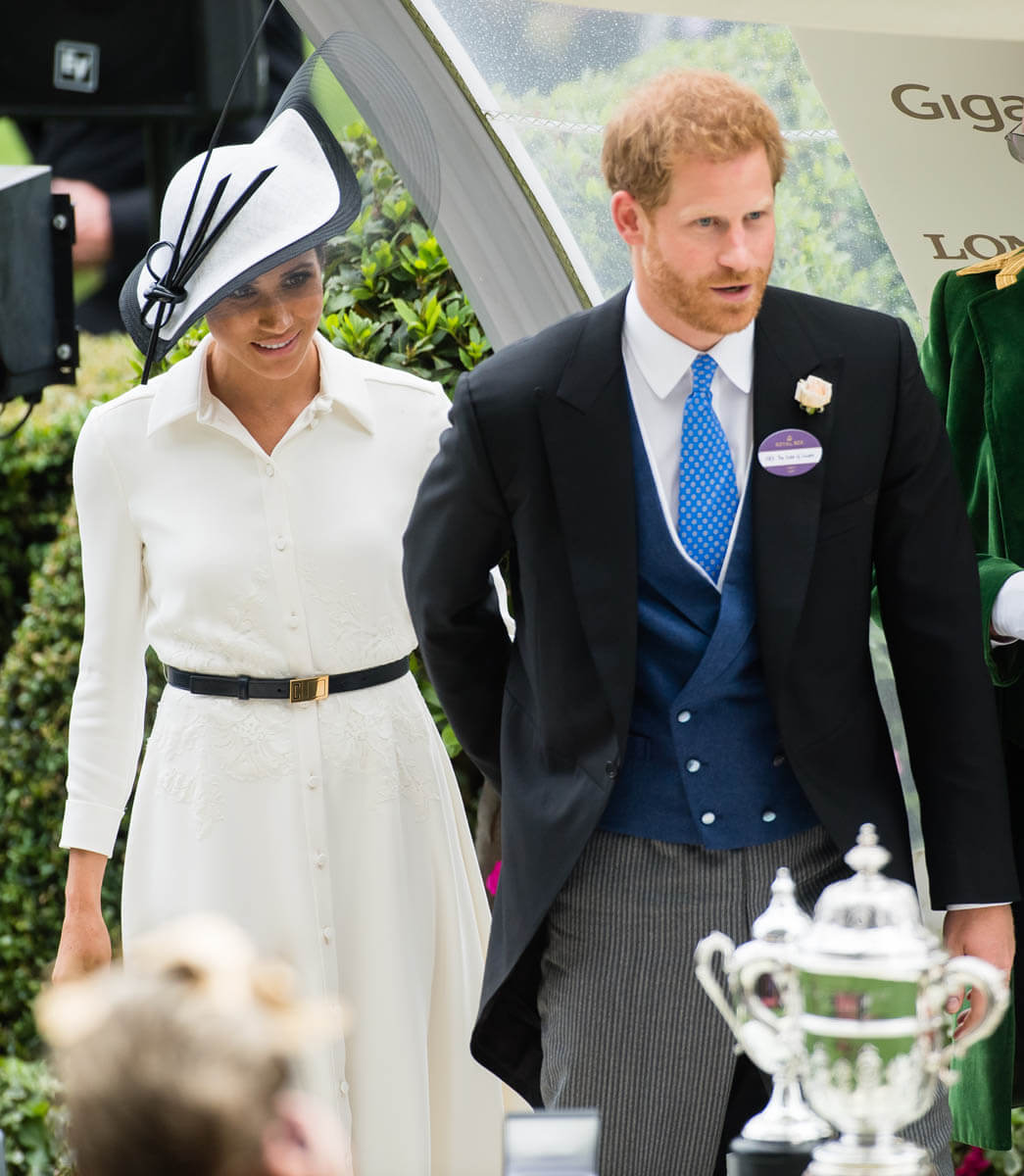 Prince Harry and Royal Meghan present a trophy