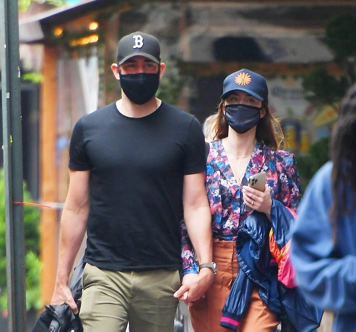 Emily and John hold hands in New York