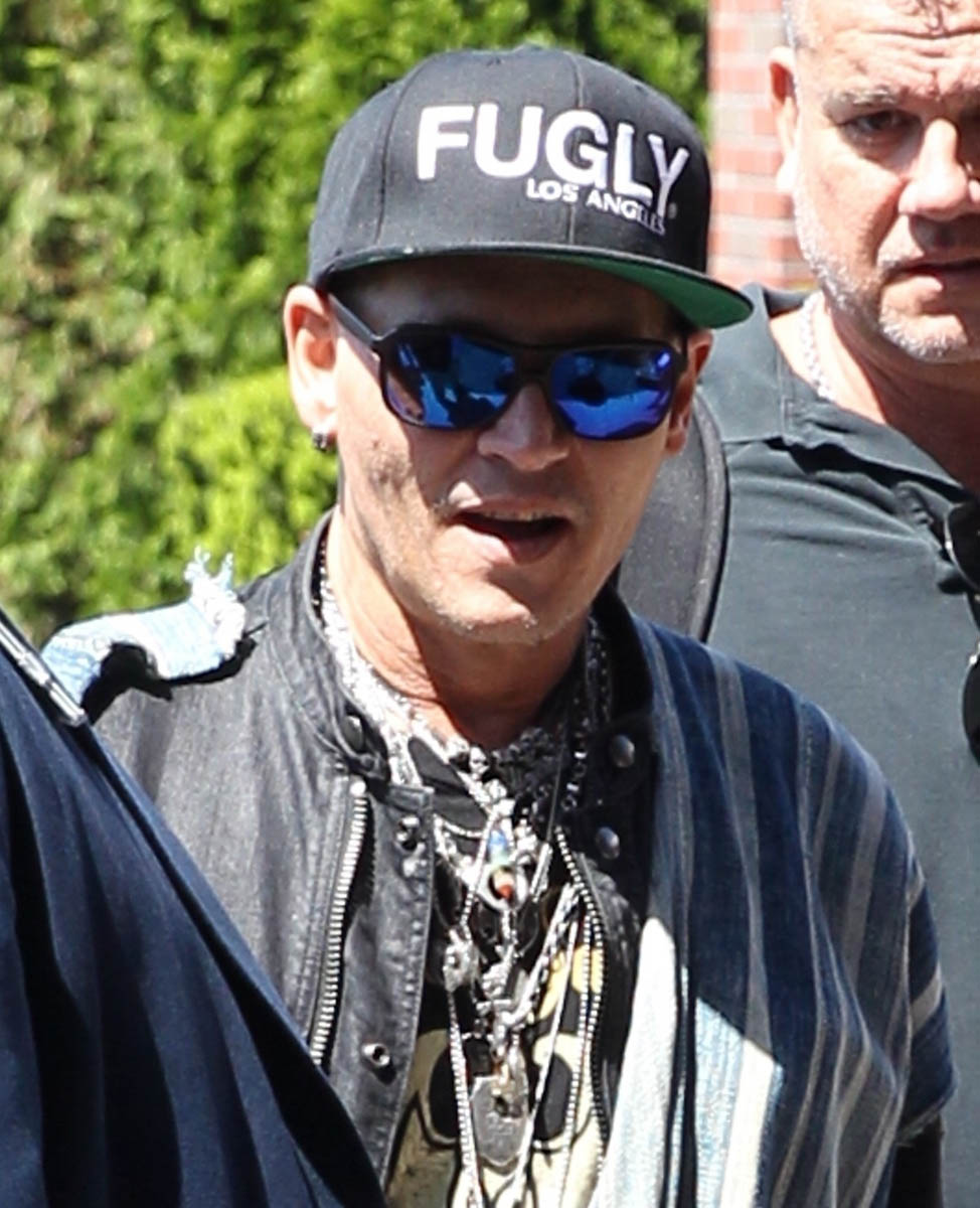 Johnny Depp wears his hat