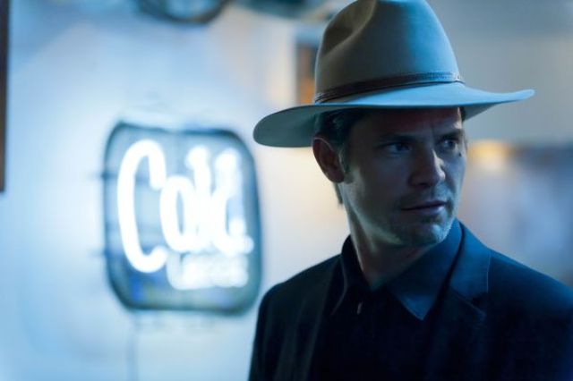 Justified 3.13: “A man in a hat pointing a gun at Boyd”