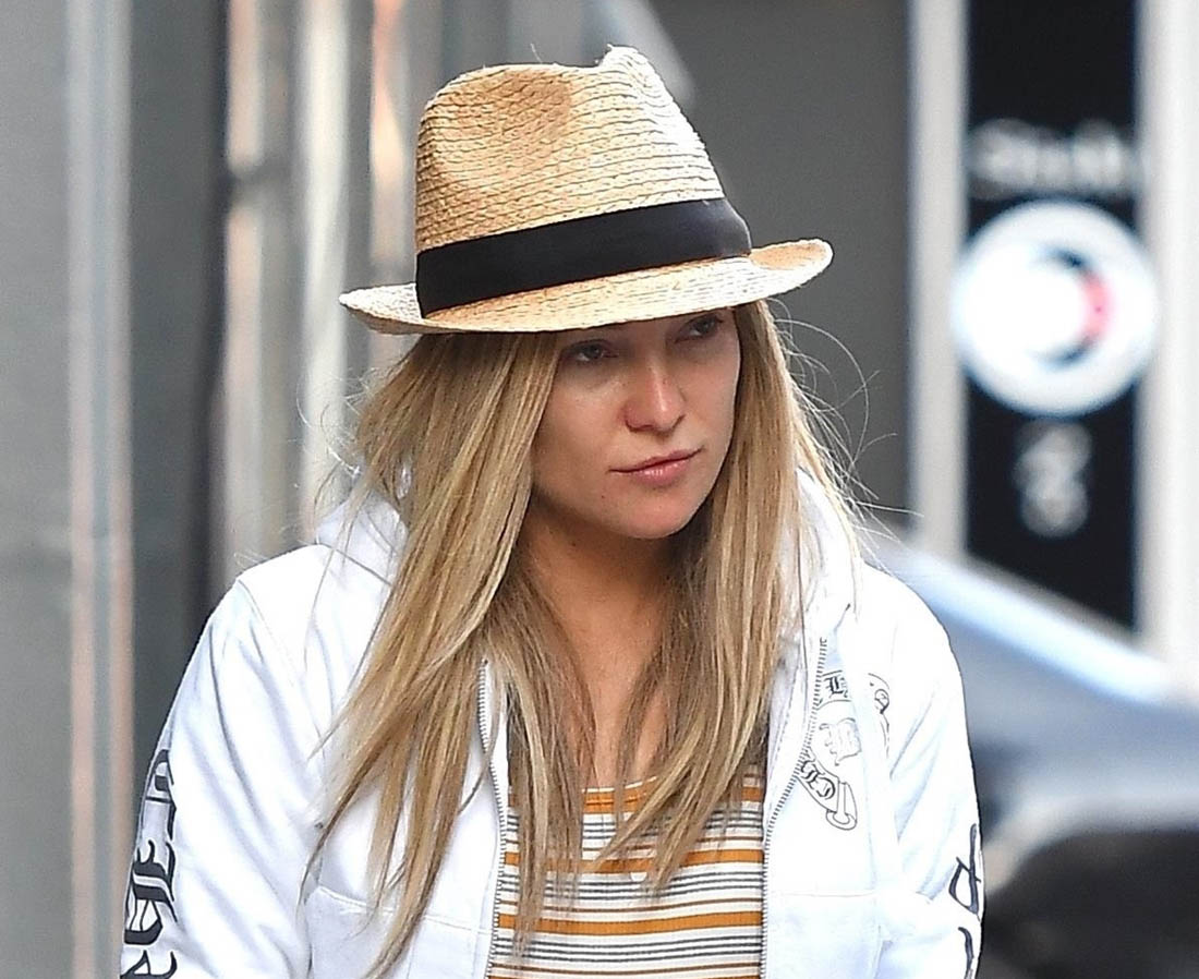 Kate Hudson hides her head