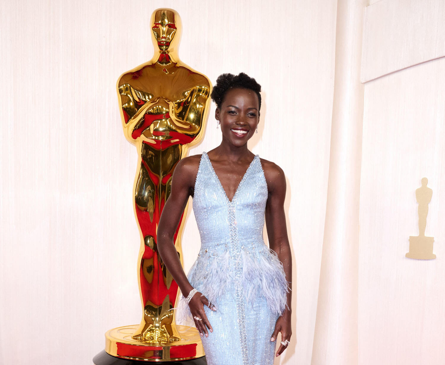 What color is Lupita’s dress?