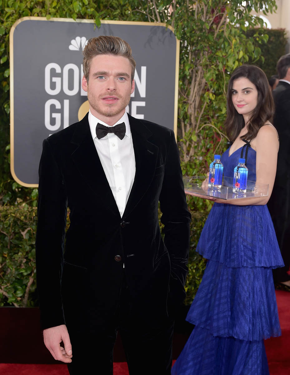 Richard Madden’s Fiji Water photobomb