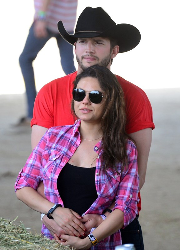Cowboy couple belly-cupping