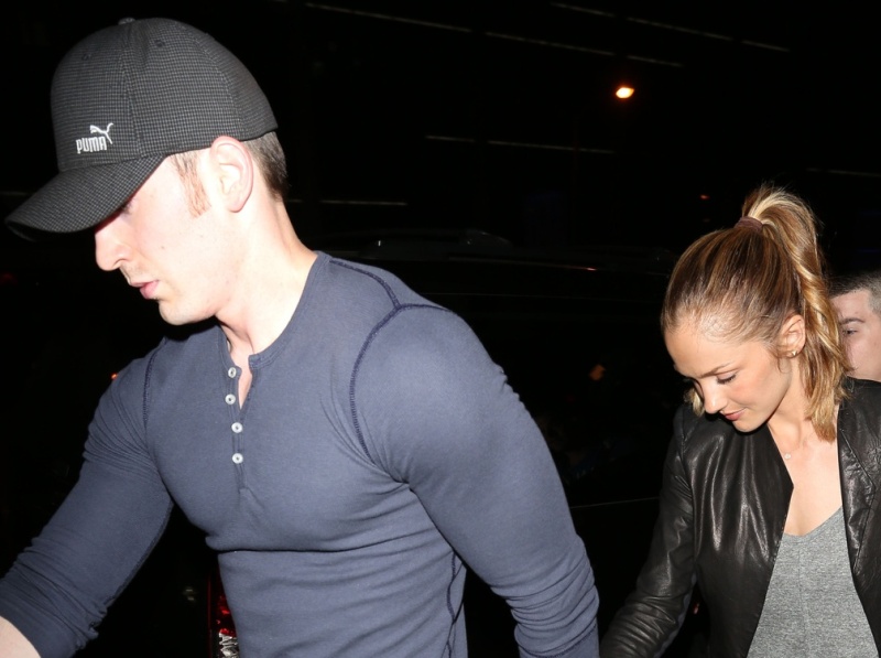 Minka Kelly and Chris Evans hold hands identically
