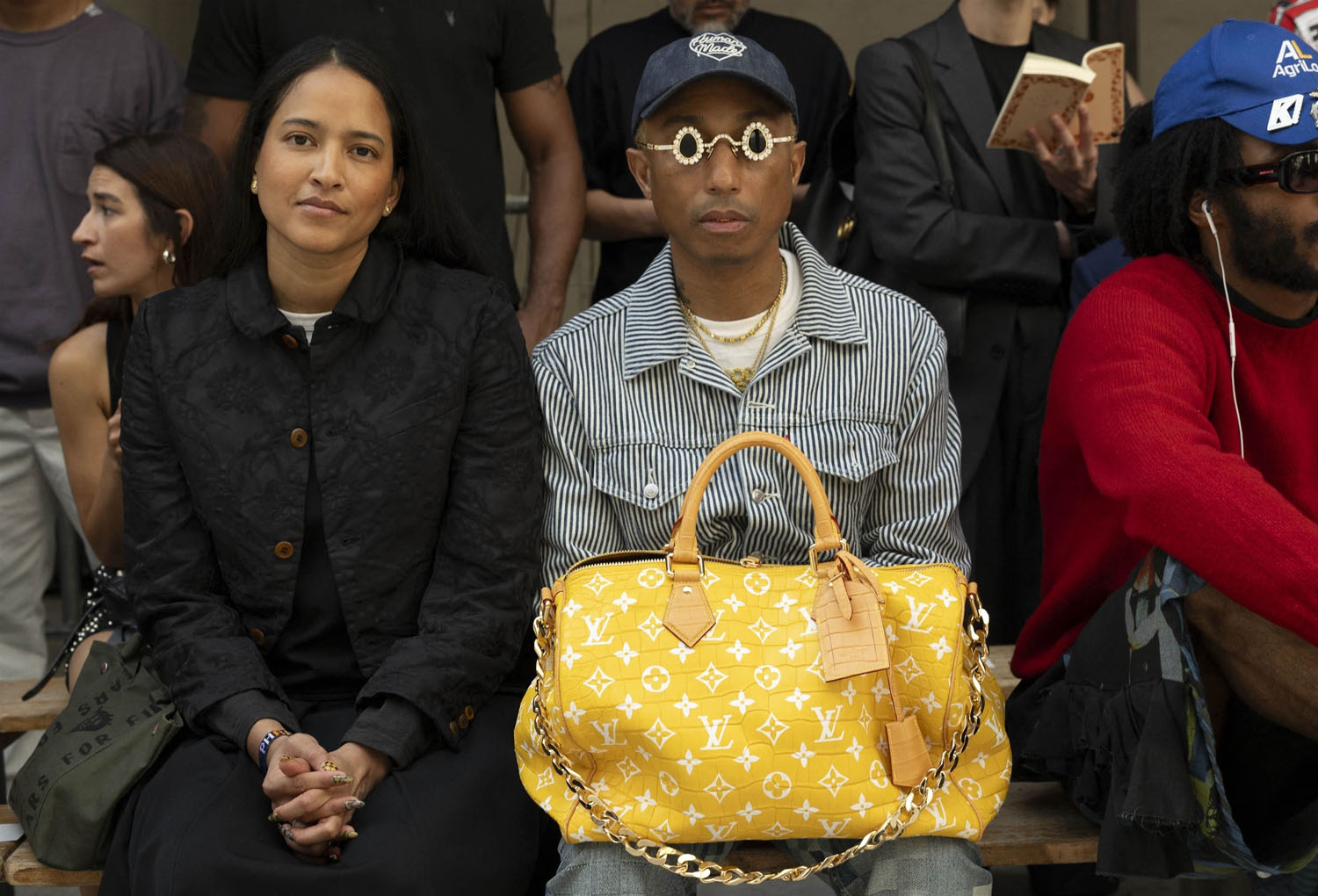Pharrell takes his bag out
