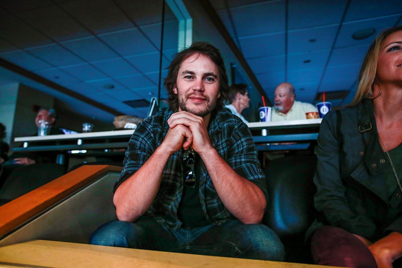 Taylor Kitsch in the hockey box