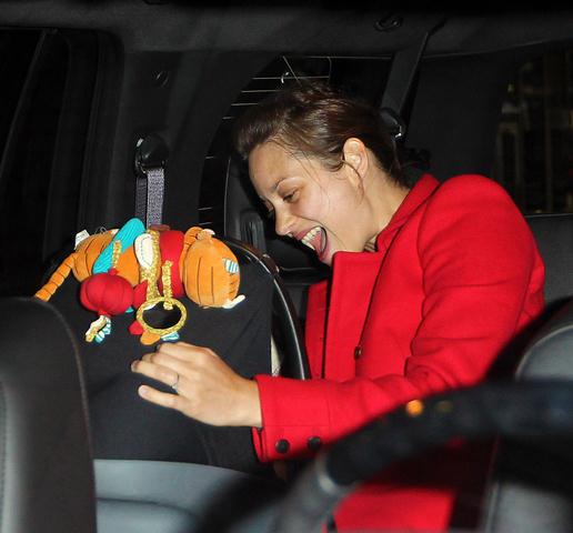 Carpets & Candids: Marion Cotillard red coat and stripes