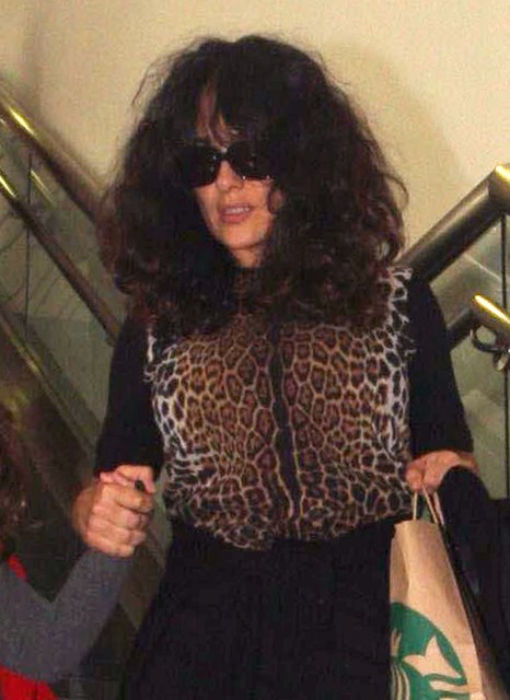 Carpets & Candids: Salma’s big hair and animal print